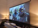 EPV Screens® projection screen displaying a scene from a sci-fi movie with two armored characters.